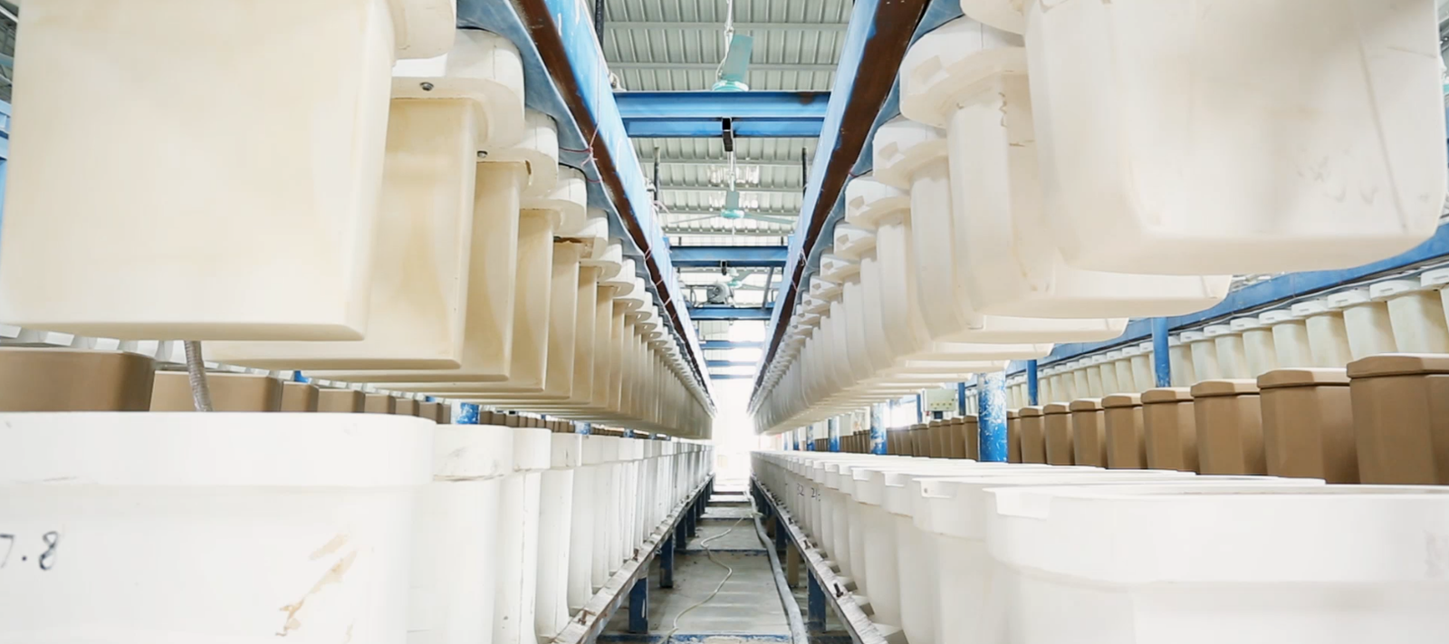 High-pressure toilet casting machinery inside the YASIQI manufacturing facility