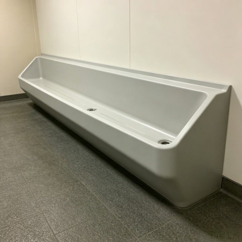Trough urinal configurations